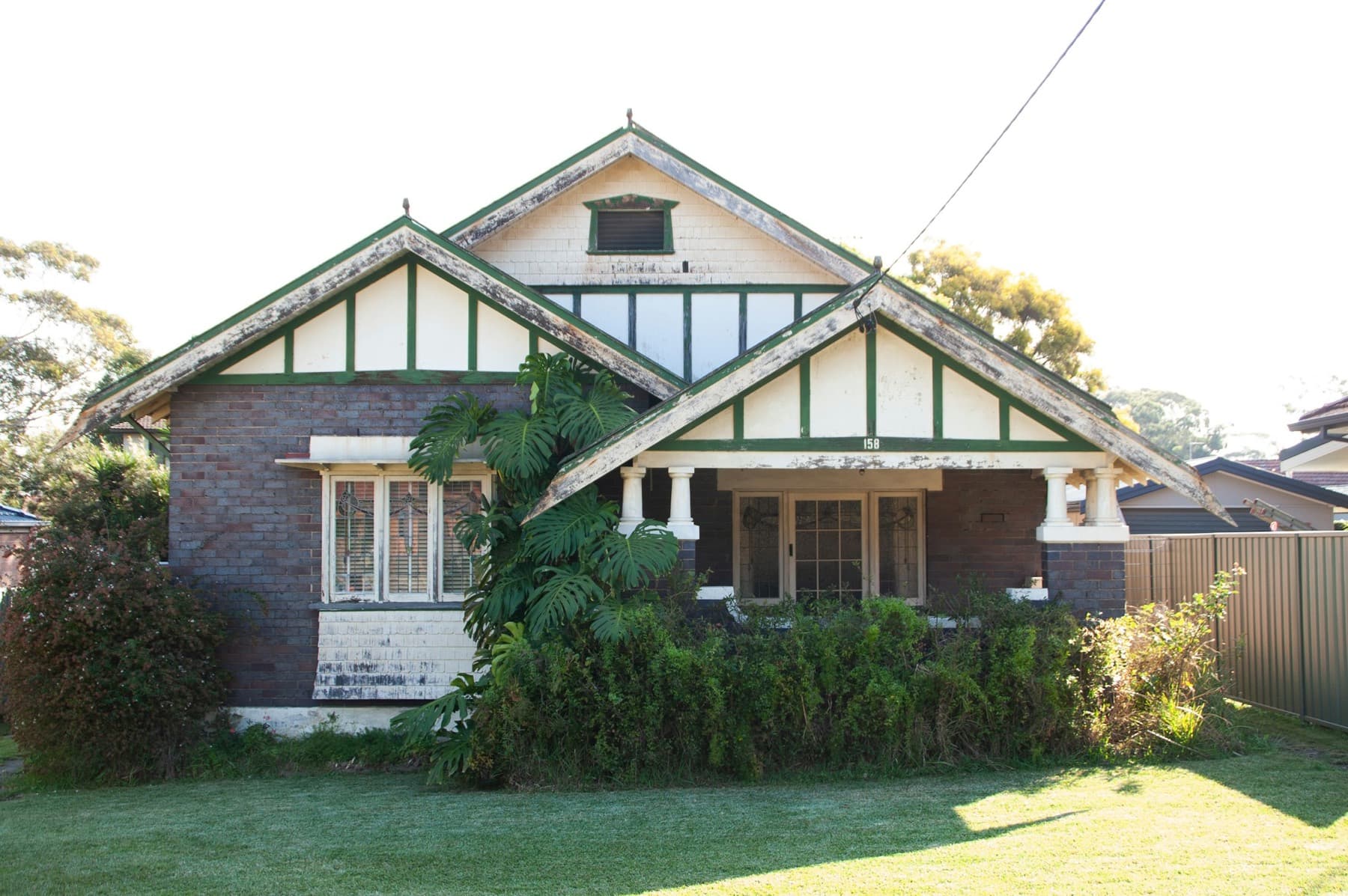 A Federation bungalow behind a hedge